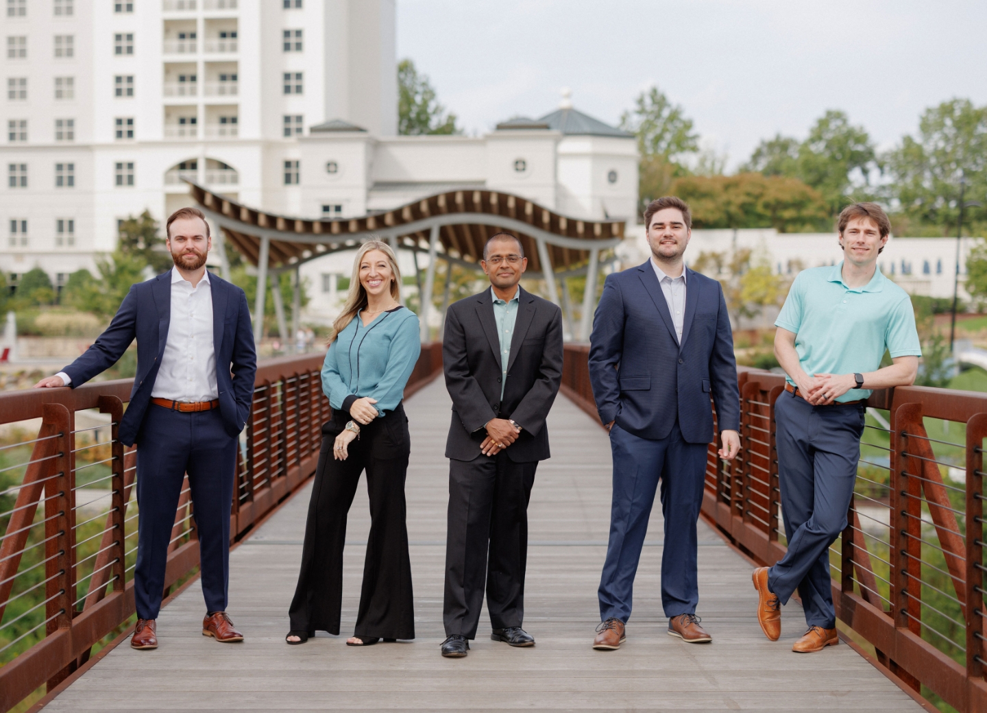 Polaris team posing on a bridge